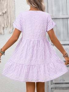 Detail view of the back of a purple gingham tiered maxi dress with short sleeves