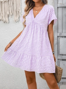 Detail of V-neck purple gingham tiered dress with flowy short sleeves for summer style