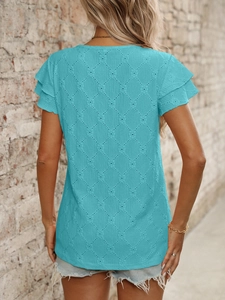 Detail of blue knit top showing diamond hollow texture and double-layered ruffle sleeves