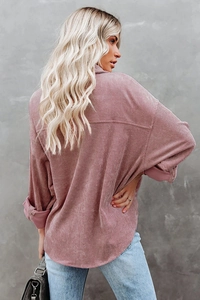 Back view of women's oversized corduroy shirt in dusty pink with drop shoulder design