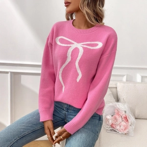 Pink crewneck knitted sweater with white bow jacquard pattern in retro casual style