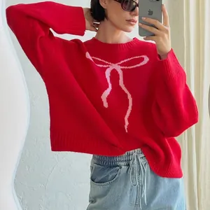 Retro red round neck knit sweater featuring a stylish pink bow jacquard pattern