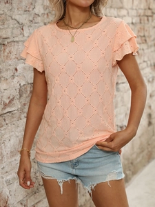 Detail of peach knit top featuring hollow-out diamond texture and layered ruffle sleeves