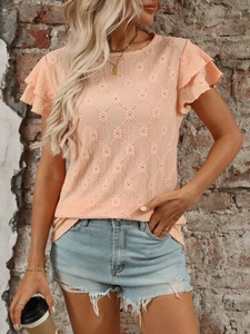 Detailed shot of hollow knit texture and double-layered ruffle sleeves on apricot top