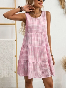 Detailed view of pink and white checkered tiered sleeveless summer dress with airy fabric