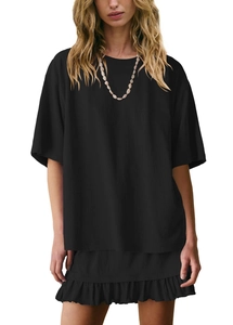 Close-up of black cotton round neck t-shirt and ruffled skirt set with shell necklace