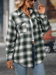Detail of classic forest green and beige plaid flannel shirt with front flap pockets