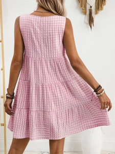 Back view of a tiered pink gingham sleeveless summer dress with tiered ruffle hemline