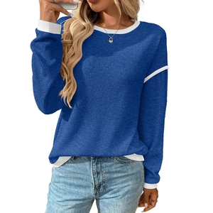 Women's blue crew neck knit sweater with white ribbed trim and casual loose fit style