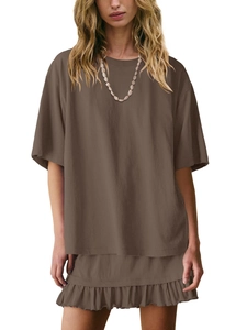 Detail of a brown two-piece knit set featuring a crewneck top and tiered ruffle skirt