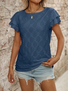 Detail of navy blue top featuring hollow geometric knit texture and ruffle short sleeves