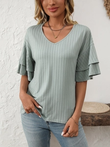 Detail of sage green V-neck ribbed knit top featuring elegant layered ruffle sleeves
