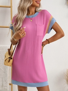 Close-up of pink ribbed knit short sleeve dress with blue striped trim and pocket detail