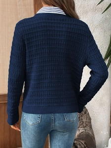 Rear view of navy blue waffle knit cardigan showing the textured fabric and back tailoring