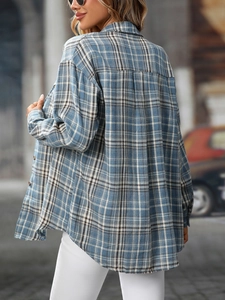 Detail view of the back pleat design on this blue and grey plaid flannel shirt