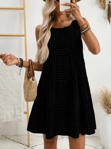Detail of black tiered plaid sleeveless dress with a textured check pattern for summer