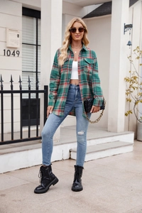 Outdoor shot of loose plaid shirt for women with green and red flannel fabric pattern