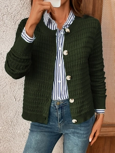 Detail view of dark green knit cardigan featuring square texture and white buttons