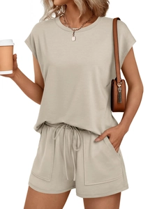 Close-up of beige round neck t-shirt and elastic drawstring shorts with side pockets