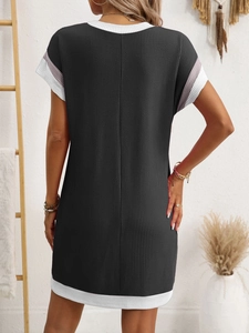 Detail of waffle knit fabric and striped cuff on a casual summer shift dress