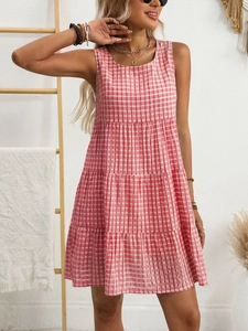Detail of red and white gingham tiered mini dress with sleeveless round neck design