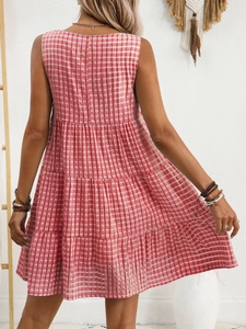 Detailed back view of red gingham sleeveless tiered dress with a flowy bohemian design
