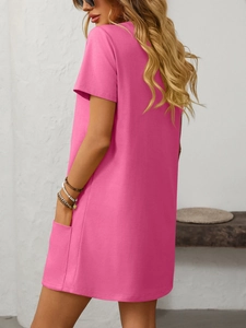 Close-up detail of the side pocket on a pink casual short-sleeve straight dress