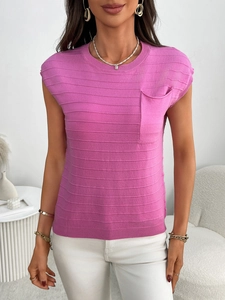 Detail of rose pink knit top featuring horizontal striped texture and chest pocket