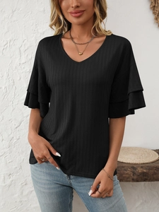 Detail view of the elegant ribbed texture and ruffle sleeves on this black V-neck t-shirt