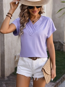 Close-up of light purple V-neck ribbed knit top with stylish textured fabric finish