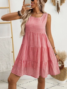 Detail of red tiered sleeveless plaid dress with a relaxed A-line silhouette for summer