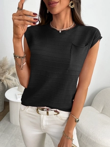 Close-up of black sleeveless knit top with pocket and wavy textured fabric detail