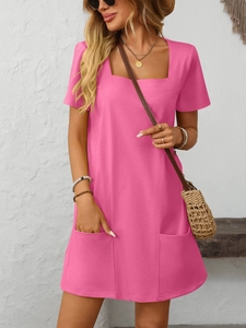 Detail view of pink square neck mini dress with stylish front pockets and summer fabric