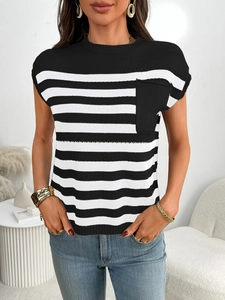 Detail view of women's black and white striped knit top with a decorative chest pocket