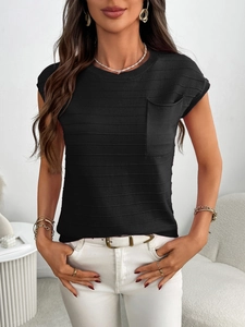 Close-up of black striped knit top featuring a front pocket and fine ribbed texture