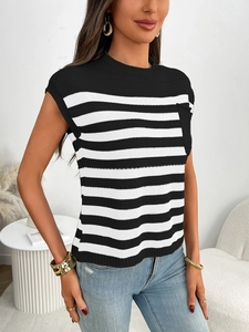 Close-up of black and white striped knit tank top featuring a round neck and chest pocket