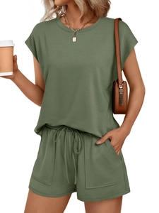 Detail of summer two-piece set featuring short sleeve top and drawstring shorts with side pockets