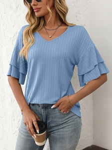 Close-up of light blue V-neck top with vertical knit texture and ruffle sleeves detail
