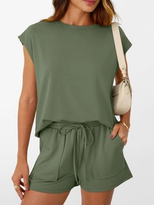 Detail of olive green lounge set showing the crewneck top and drawstring shorts fabric