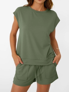 Detailed texture of olive green waffle knit fabric on casual short set with drawstring
