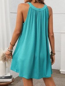 Detail view of Tiffany blue sleeveless dress featuring vertical pleated texture and A-line cut