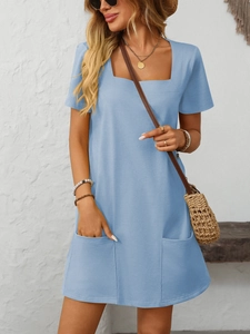 Detail of light blue square neck dress with short sleeves and front pockets for summer wear