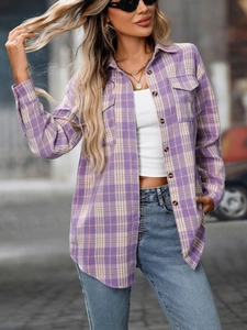 Close-up of purple plaid shirt with two chest pockets and button-down collar