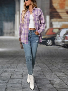 Detail of purple plaid shirt paired with high-waist jeans and chic white boots