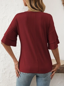 Detailed back view of burgundy ribbed knit top showing layered ruffle sleeves