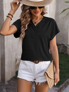 Detail of V-neckline and vertical ribbed texture on black short sleeve summer top