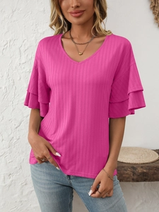 Detail of V-neckline and ruffled layers on the sleeve of this fuchsia knit top