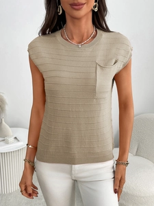 Macro shot of khaki short-sleeve knit sweater with textured stripes and chest pocket detail