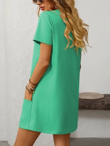 Detail view of the side pocket on a mint green short sleeve casual dress with H-line cut