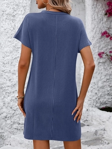 Detail view of grey blue vertical striped texture on a casual short sleeve dress